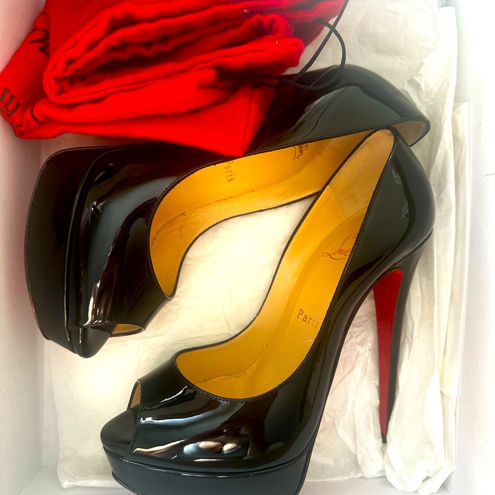 Louboutin black heels / shoes.